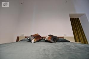 Postel nebo postele na pokoji v ubytování Corte Cairoli B&B and Suites