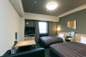 TV a/nebo společenská místnost v ubytování Hotel Route-Inn Shimizu Inter