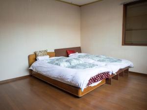 Guesthouse ENN客房内的一张或多张床位