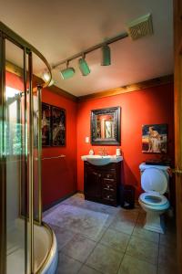 a bathroom with a toilet and a sink and a shower at Shambhala Bed and Breakfast in Buckhorn