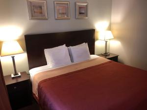 Postel nebo postele na pokoji v ubytování Global Inn