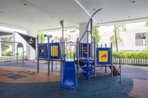 a playground with a blue slide in a park at SetiaWalk {BIG GROUP}12Pax WIFI 2C'Park IOI SUNWAY SUBANG USJ in Puchong