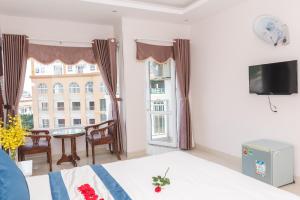 TV a/nebo společenská místnost v ubytování Kyo Hotel