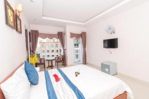 TV a/nebo společenská místnost v ubytování Kyo Hotel