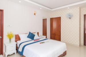 Postel nebo postele na pokoji v ubytování Kyo Hotel
