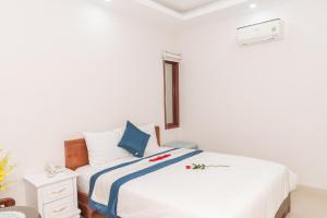 Postel nebo postele na pokoji v ubytování Kyo Hotel