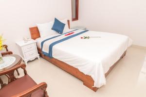 Postel nebo postele na pokoji v ubytování Kyo Hotel