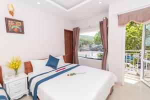 Postel nebo postele na pokoji v ubytování Kyo Hotel