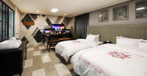 Uma cama ou camas num quarto em Hotel Mondavi