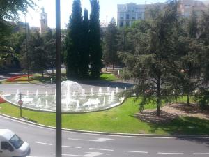 a fountain in the middle of a park at Casa de Huéspedes Cuenca in Madrid