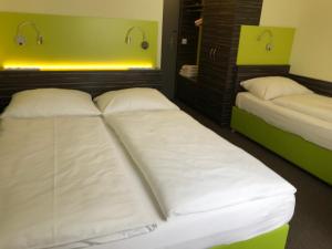 Voodi või voodid majutusasutuse Behringers City Hotel Nürnberg toas