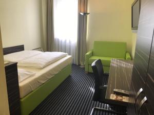 Voodi või voodid majutusasutuse Behringers City Hotel Nürnberg toas
