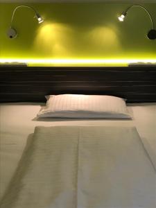 Voodi või voodid majutusasutuse Behringers City Hotel Nürnberg toas