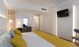 Postel nebo postele na pokoji v ubytování Medplaya Hotel Rio Park