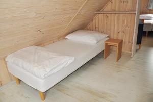 Postel nebo postele na pokoji v ubytování domki rainers