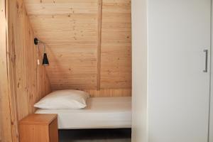 Postel nebo postele na pokoji v ubytování domki rainers