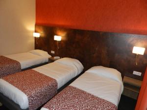 Letto o letti in una camera di Hôtel Gloria & Avenue