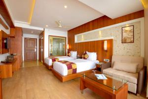 Postel nebo postele na pokoji v ubytování Amber Dale Luxury Hotel & Spa, Munnar