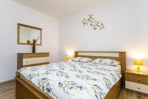 Postel nebo postele na pokoji v ubytování Holiday House Snjezana