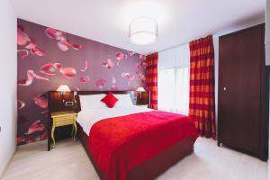 Postel nebo postele na pokoji v ubytování Derby Apart Hotel
