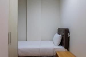 Ένα ή περισσότερα κρεβάτια σε δωμάτιο στο Homey 2BR at 1st Floor Asatti Apartment By Travelio +10 φωτογραφίες
