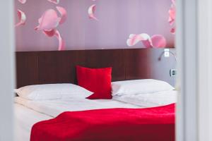 Postel nebo postele na pokoji v ubytování Derby Apart Hotel