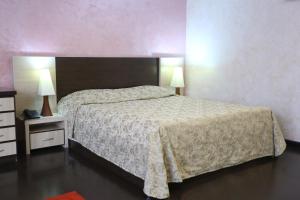 Postel nebo postele na pokoji v ubytování Vanatur Hotel