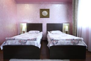 Postel nebo postele na pokoji v ubytování Vanatur Hotel