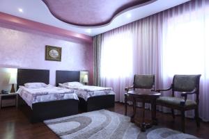 Postel nebo postele na pokoji v ubytování Vanatur Hotel