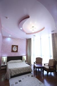 Postel nebo postele na pokoji v ubytování Vanatur Hotel