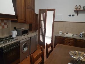 A kitchen or kitchenette at Piccolo Poggio Apartments