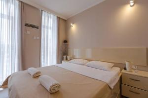 Ένα ή περισσότερα κρεβάτια σε δωμάτιο στο Wehost Apartment in Orbi tower