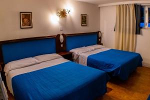 Postel nebo postele na pokoji v ubytování Residence Al Lago