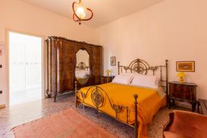 a bedroom with a bed and a large mirror at B&B Luci a'mmare in Roseto degli Abruzzi