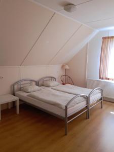 En eller flere senge i et værelse på Camping Prima