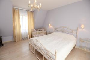 Katil atau katil-katil dalam bilik di Villa Ponto Palanga