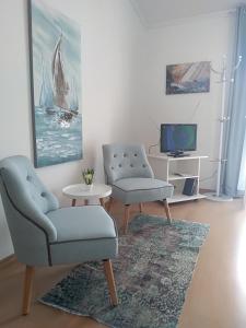 TV a/nebo společenská místnost v ubytování Apartments & Rooms Vitt