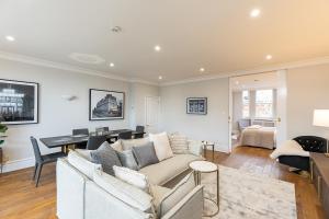 a living room with a couch and a table at ALTIDO Luxury 2 bed flats with terraces near Piccadilly Circus in London