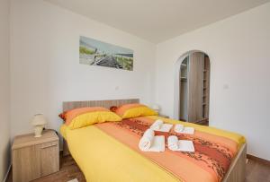 Postel nebo postele na pokoji v ubytování Apartments Ivan 813