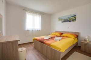 Postel nebo postele na pokoji v ubytování Apartments Ivan 813