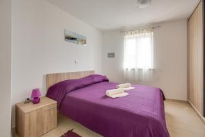 Postel nebo postele na pokoji v ubytování Apartments Ivan 813