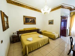 Postel nebo postele na pokoji v ubytování Euro Hotel Iglesias