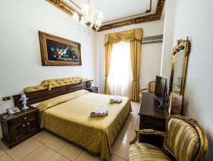 Postel nebo postele na pokoji v ubytování Euro Hotel Iglesias