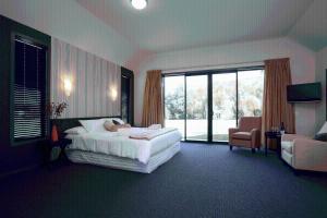 Postel nebo postele na pokoji v ubytování Hawkdun Lodge Motel