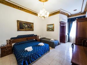 Postel nebo postele na pokoji v ubytování Euro Hotel Iglesias