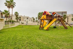 a playground with a slide in a park at Solare Garden Villa #773 in South Padre Island