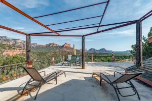 deck with chairs and views of the grand canyon at Spectacular View in Sedona