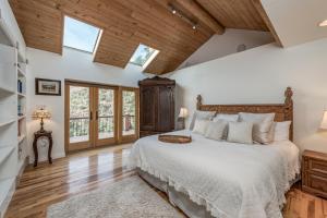 a bedroom with a large bed and windows at Spectacular View in Sedona