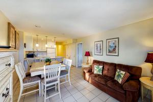 a living room with a couch and a table at Solare Garden Villa #773 in South Padre Island