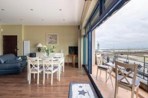 a living room with a view of the ocean at La Bisquine - Appt pour 4 avec vue mer in Cancale